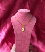 Dollar sign necklace